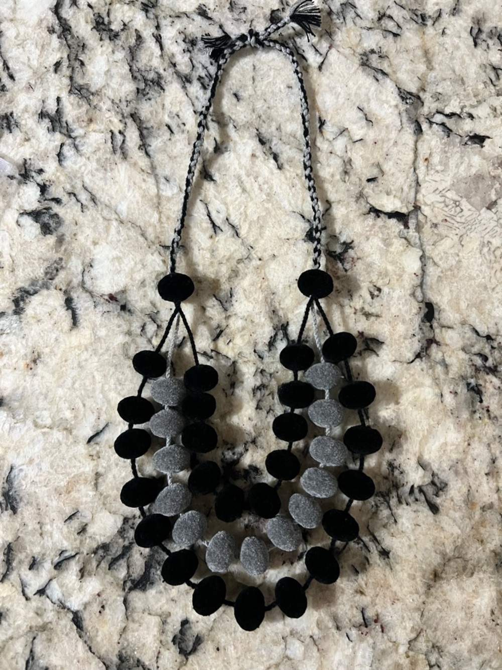 Handmade black and grey Mexican Pom Pom cotton necklace.